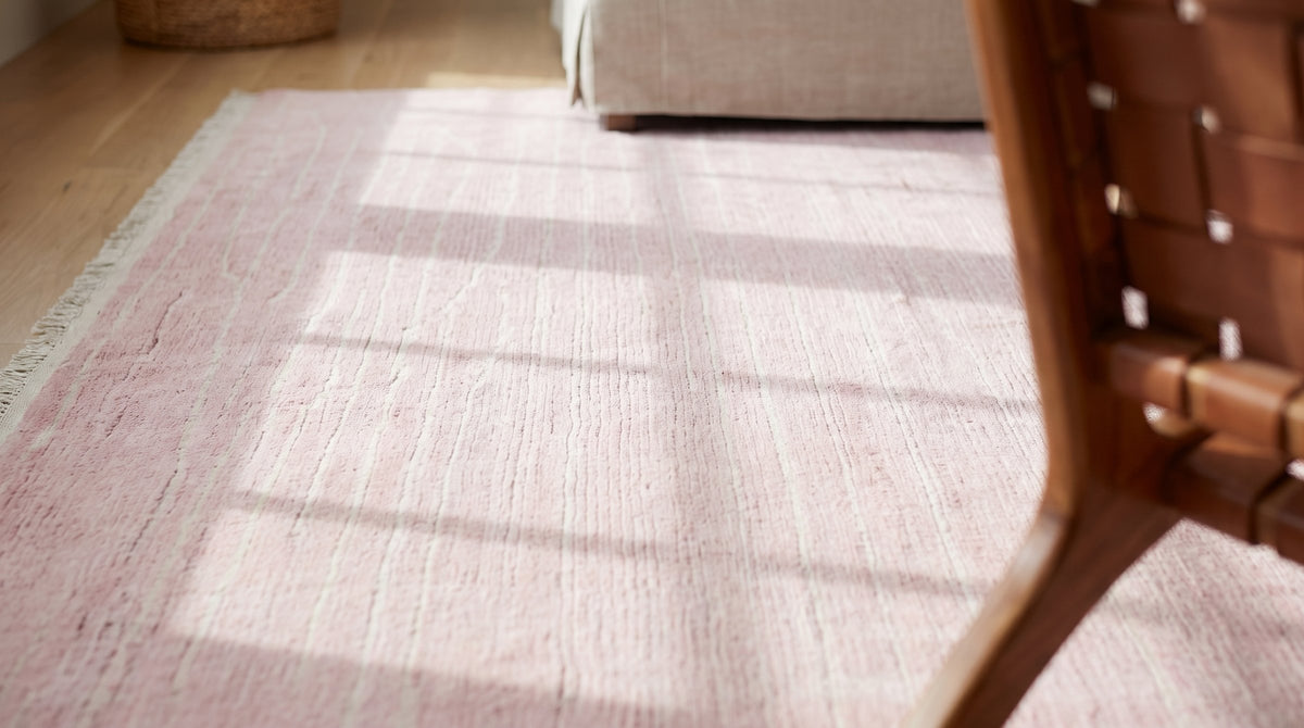 Rhea Moroccan Pink Hand Knotted Wool Rug in a living room