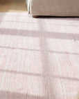 Rhea Moroccan Pink Hand Knotted Wool Rug in a living room