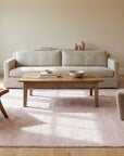 Rhea Moroccan Pink Hand Knotted Wool Rug in a living room