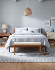 Rhea Stylish Blue Hand Tufted Wool Rug in a bedroom