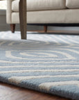 Rhea Stylish Blue Hand Tufted Wool Rug in a living room