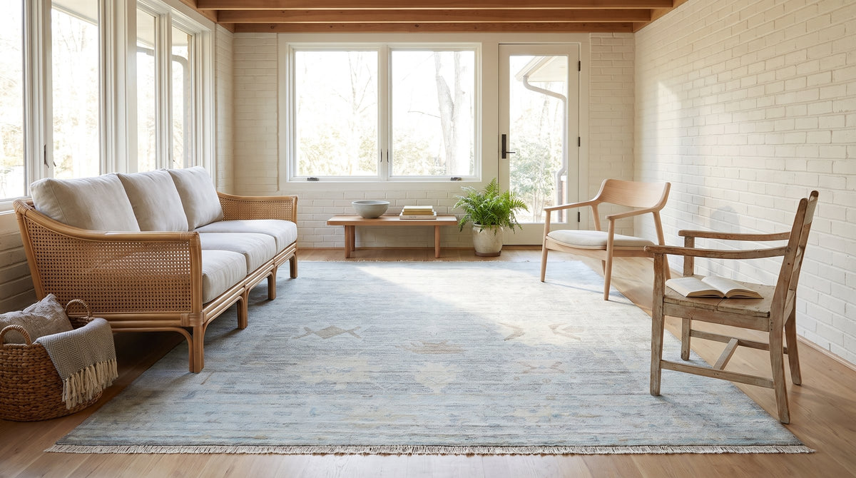 Ruby Fiona Ivory Hand Knotted Silk Rug in a sunroom