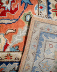 Rust Oushak rug corner folded showing the back
