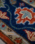 Rust Oushak rug navy border motif close-up