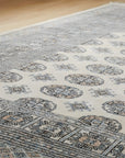 Rustic Nina Beige Hand Knotted Wool Rug in a bedroom