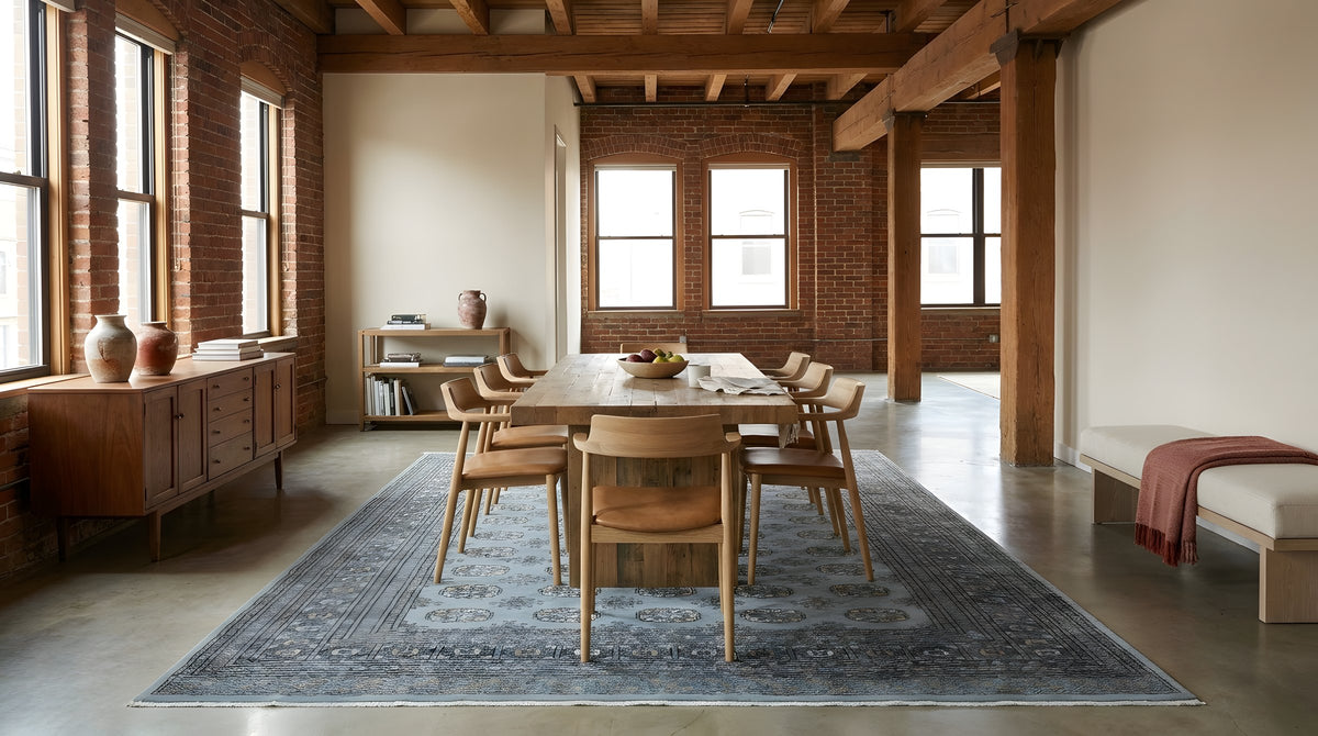 Rustic Nina Gray Hand Knotted Wool Rug in a dining room