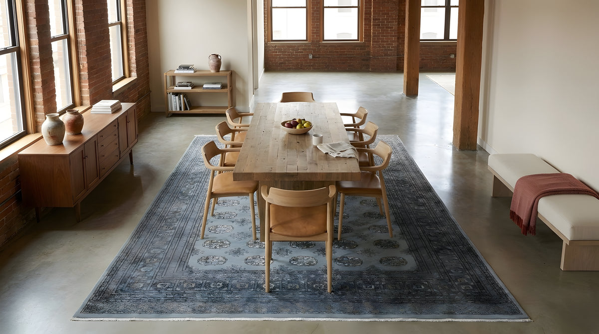 Rustic Nina Gray Hand Knotted Wool Rug in a dining room