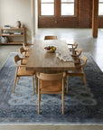 Rustic Nina Gray Hand Knotted Wool Rug in a dining room