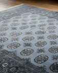 Rustic Nina Gray Hand Knotted Wool Rug in a reading nook