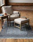 Rustic Nina Gray Hand Knotted Wool Rug in a reading nook