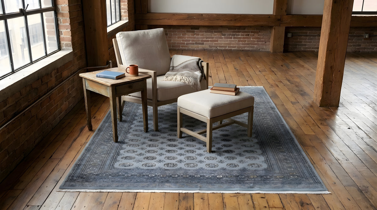 Rustic Nina Gray Hand Knotted Wool Rug in a reading nook