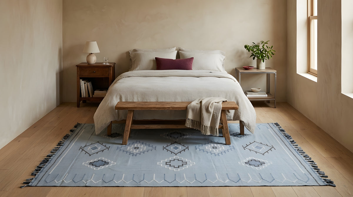 Rustic Penelope Silver Flatweave Rug in a bedroom