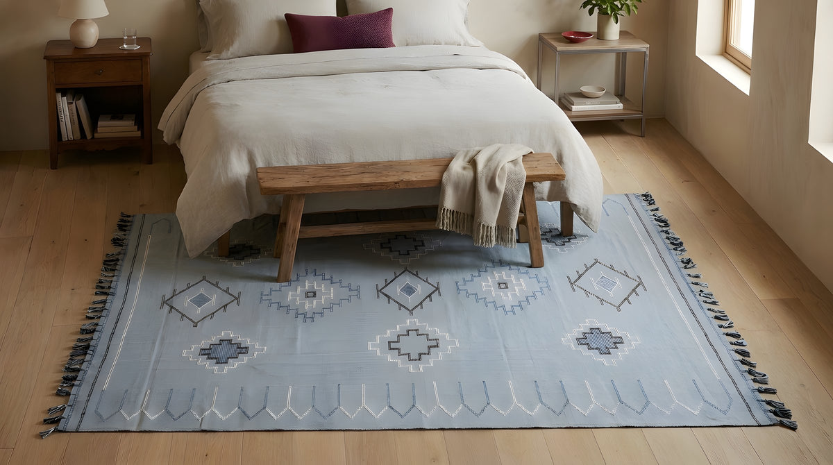 Rustic Penelope Silver Flatweave Rug in a bedroom