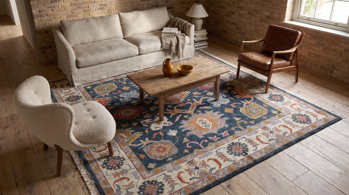 Sarrah Oushak Charcoal and Ivory Hand Knotted Wool Rug in a living room