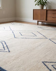 Selene Moroccan Ivory Hand Knotted Wool Rug in a dining room