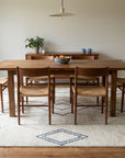 Selene Moroccan Ivory Hand Knotted Wool Rug in a dining room