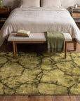 Sleek Cozy Green Hand Knotted Wool Rug in a bedroom