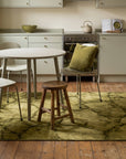 Sleek Cozy Green Hand Knotted Wool Rug in a kitchen