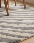 Sleek Graceful Multicolor Hand Tufted Wool Rug in a dining room