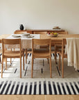 Sloane Majestic Gray and Ivory Flatweave Wool Rug in a dining room