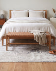 Sumptuous Lila Beige and Gray Machine Made Wool Rug in a bedroom