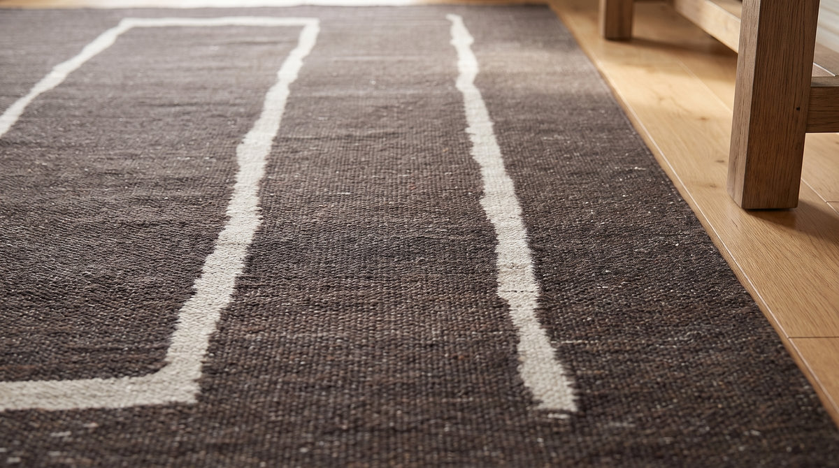 Talia Delicate Brown Flatweave Wool Rug in a hallway