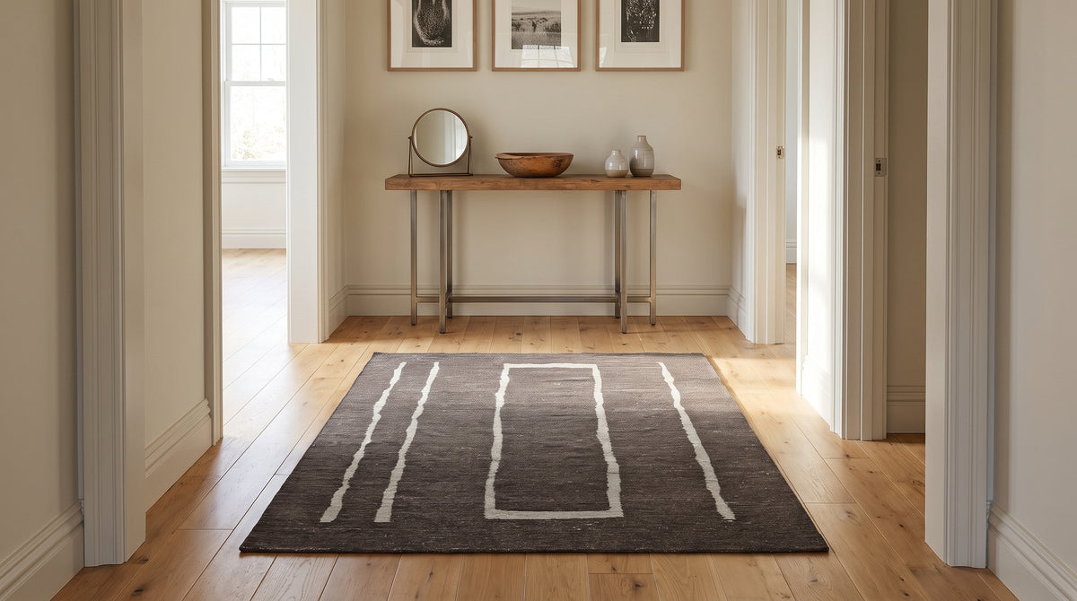 Talia Delicate Brown Flatweave Wool Rug in a hallway