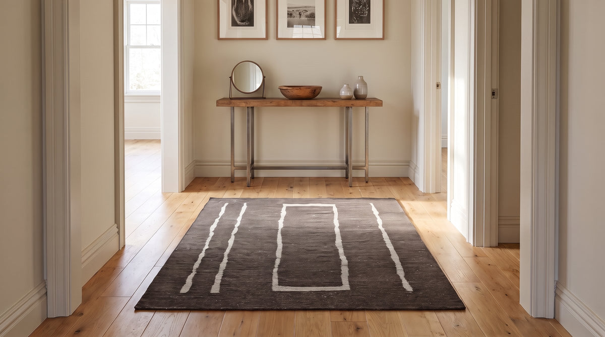 Talia Delicate Brown Flatweave Wool Rug in a hallway