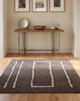 Talia Delicate Brown Flatweave Wool Rug in a hallway