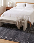 Talia Moroccan Charcoal Hand Knotted Wool Rug in a bedroom
