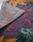 Teal contemporary floral rug back corner detail