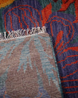 Teal contemporary floral rug hand-knotted back detail