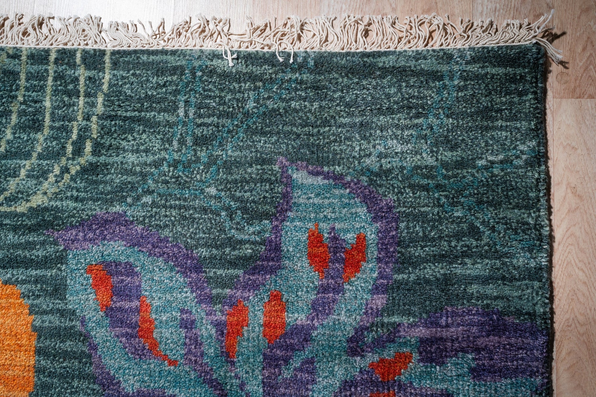 Teal contemporary floral rug corner detail