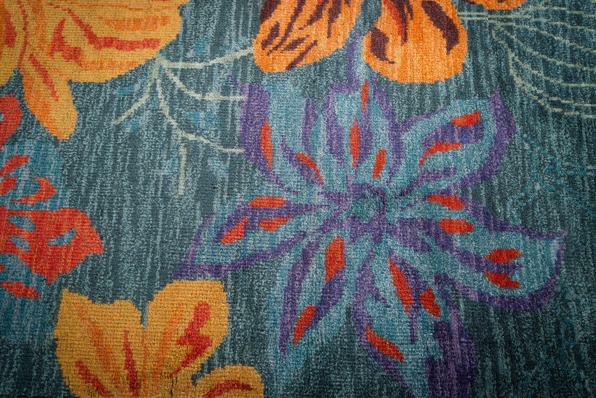 Teal contemporary floral rug blossom motif close-up