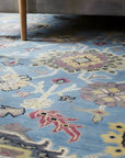 Tessa Laine Blue Hand Knotted Wool Rug in a bedroom