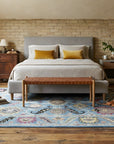 Tessa Laine Blue Hand Knotted Wool Rug in a bedroom