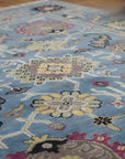 Tessa Laine Blue Hand Knotted Wool Rug in a dining room