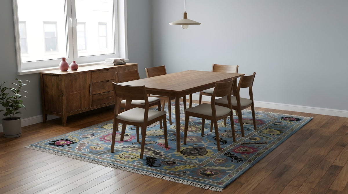 Tessa Laine Blue Hand Knotted Wool Rug in a dining room