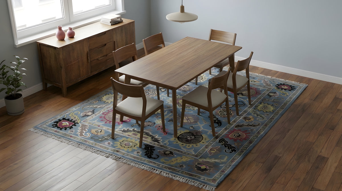 Tessa Laine Blue Hand Knotted Wool Rug in a dining room