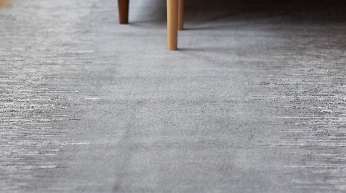 Tessa Maya Gray Hand Knotted Wool Rug in a bedroom