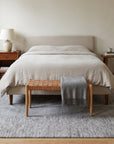 Tessa Maya Gray Hand Knotted Wool Rug in a bedroom