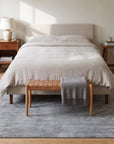 Tessa Maya Gray Hand Knotted Wool Rug in a bedroom