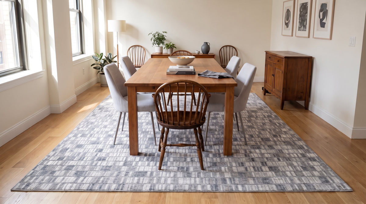 Tessa Sophisticated Gray Hand Knotted Wool Rug in a dining room