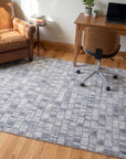 Tessa Sophisticated Gray Hand Knotted Wool Rug in a home office