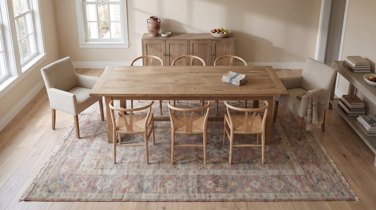 Timeless Oushak Pink Hand Knotted Wool Rug in a dining room