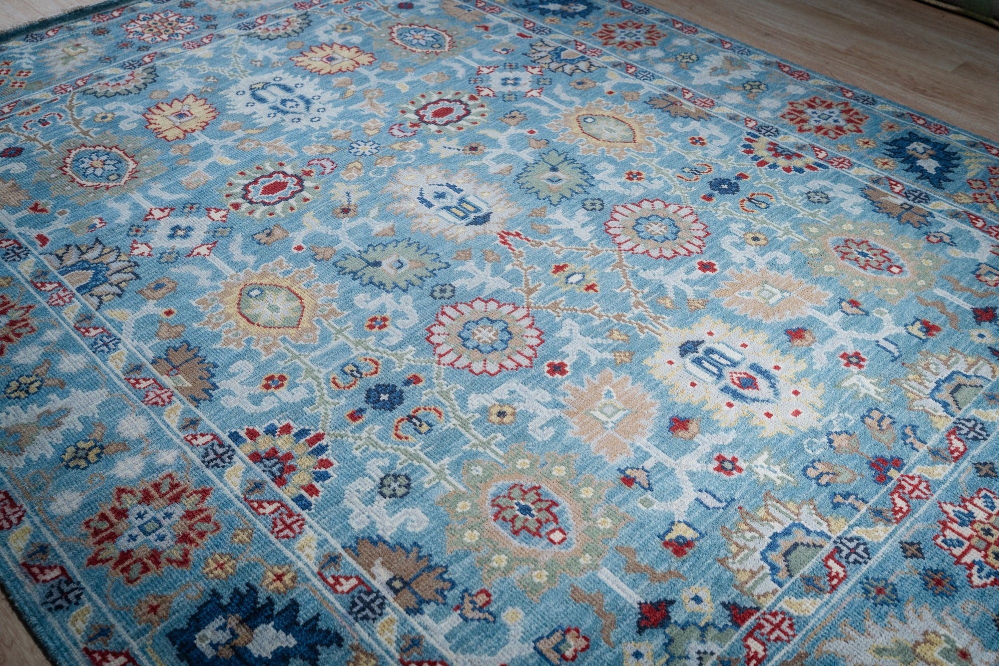 Turquoise Oushak rug angled field detail