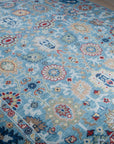 Turquoise Oushak rug angled field detail