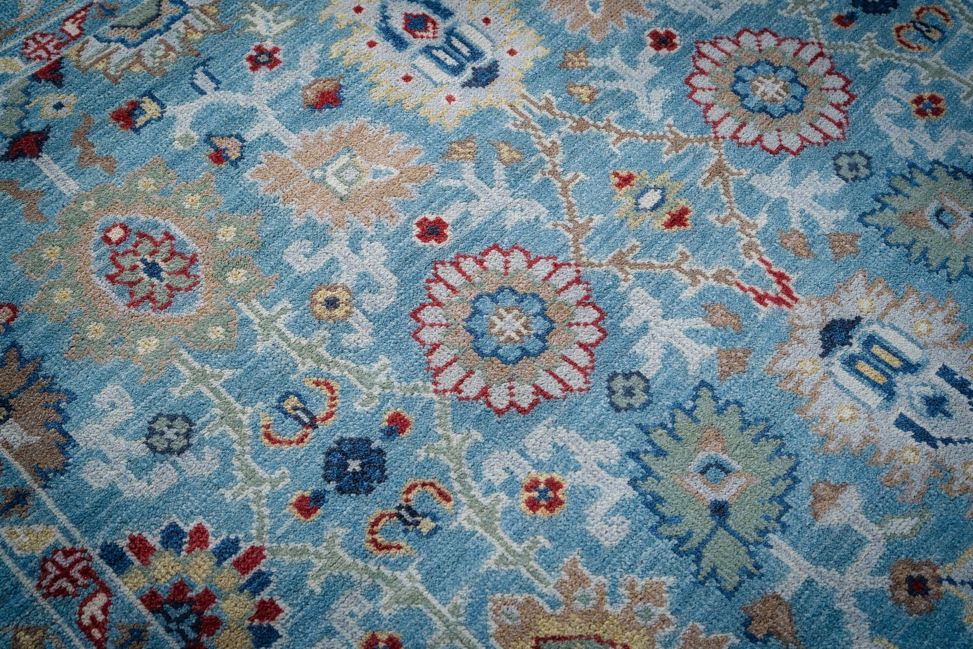 Turquoise Oushak rug floral field close-up