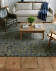 Unique Cozy Green Hand Knotted Wool Rug in a living room