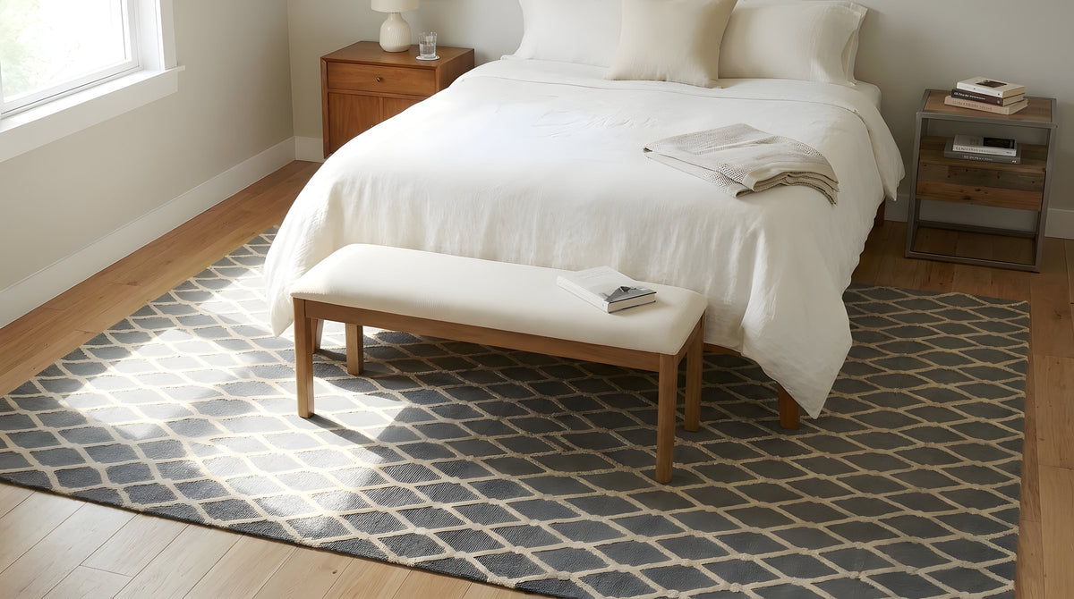 Versatile Comfortable Gray Hand Tufted Wool Rug in a bedroom